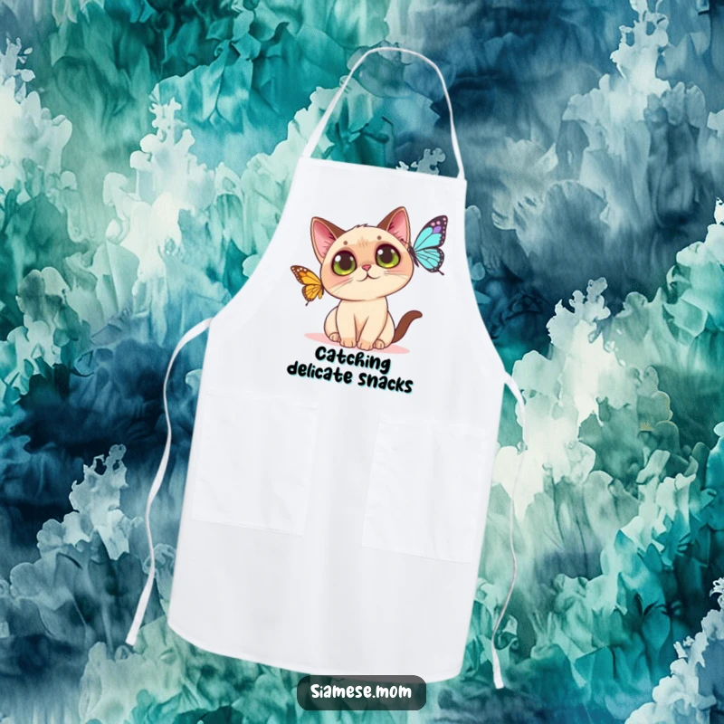 Funny Kawaii Siamese cat apron designed with a curious cat batting at a butterfly, ideal for a playful cook.