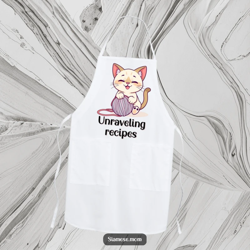 Funny Siamese Cat Apron: Playful design of a smiling cat entangled with a rolling ball of yarn, ideal for creative fun.
