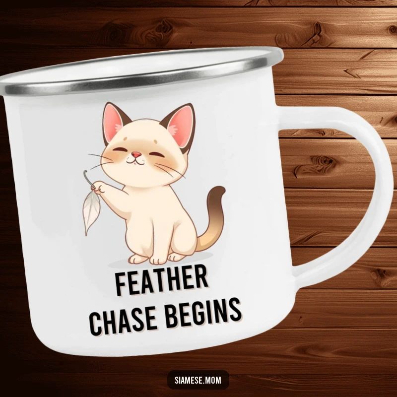 Funny Siamese Cat Camping Mug: A playful Siamese cat batting at a feather, bringing humor and joy to outdoor sips.