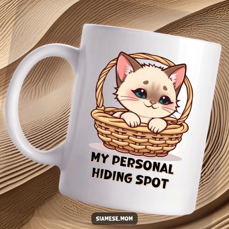 Funny Kawaii Siamese Cat Mug, playfully peeking from a basket with a smirk, perfect for unique cat lover gifts.