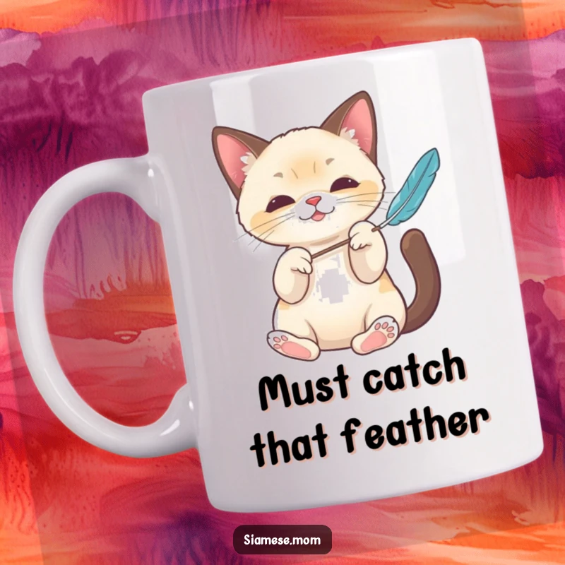 Funny Kawaii Siamese cat mug showing elegant paws batting a feather toy, perfect for playful cat enthusiasts and a great gift.
