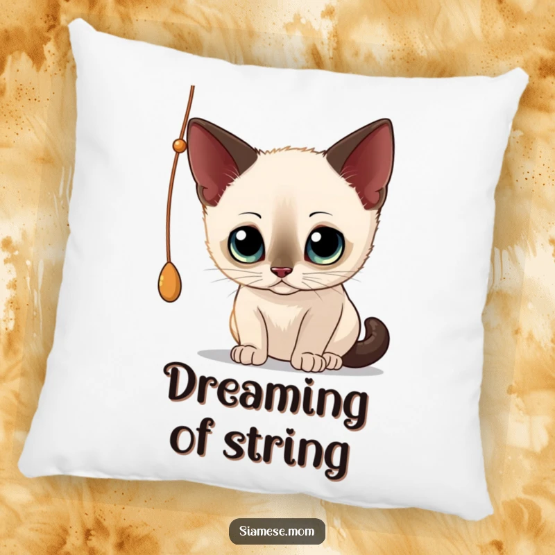 Funny Siamese Cat Pillow: Soft cushion featuring a curious cat batting at a dangling string, adding playful decor.