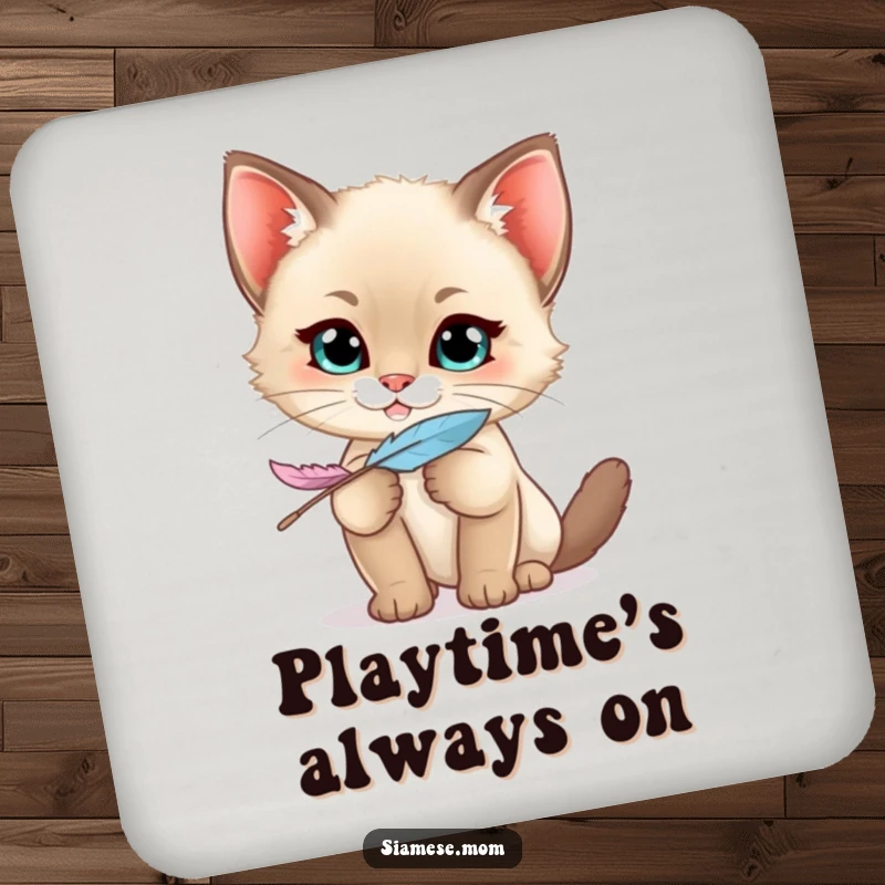 Funny Siamese Kitten Coaster featuring a kawaii cat with a mischievous grin holding a feather, protecting surfaces with playful charm.