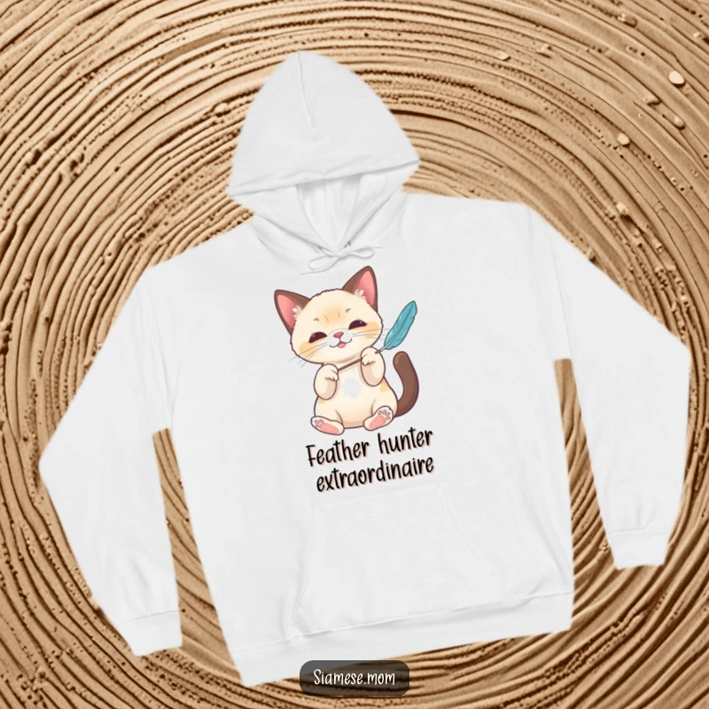 Funny Kawaii Siamese cat hoodie featuring elegant paws batting a feather toy, offering cozy comfort and a touch of playful humor.