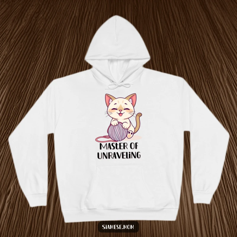 Funny Siamese Cat Hoodie: Soft hoodie with a smiling cat playfully engaged with a ball of yarn, showcasing creative fun.