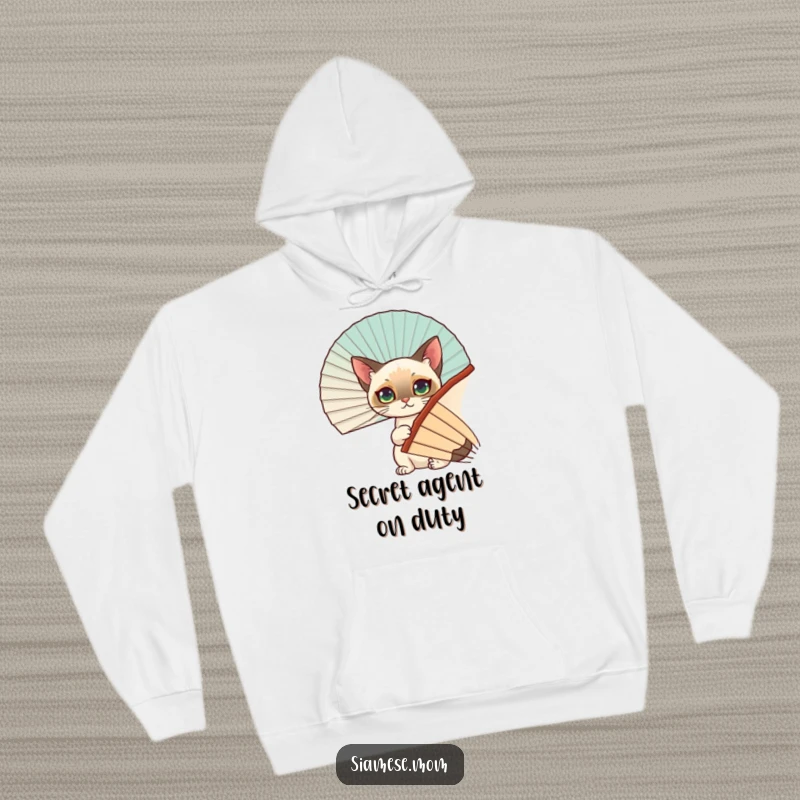 Funny Siamese Cat Hoodie: A cuddly Siamese cat playfully hides behind a large fan, offering a humorous and cozy visual.