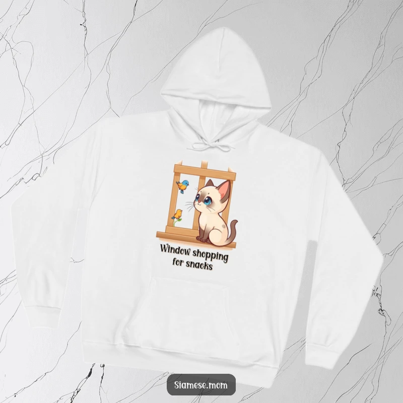 Funny Kawaii Siamese cat hoodie of a cat intently watching a bird outside a window, offering cozy humor.