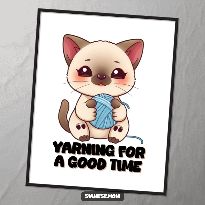 Cute free printable wall art featuring a kawaii Siamese cat playfully holding a small ball of yarn, perfect for a charming space.