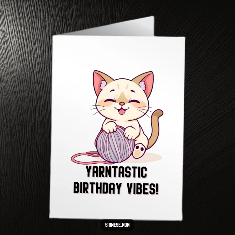 Funny Free Printable Birthday Card: A stylized, smiling Siamese cat gleefully playing with a rolling ball of yarn.
