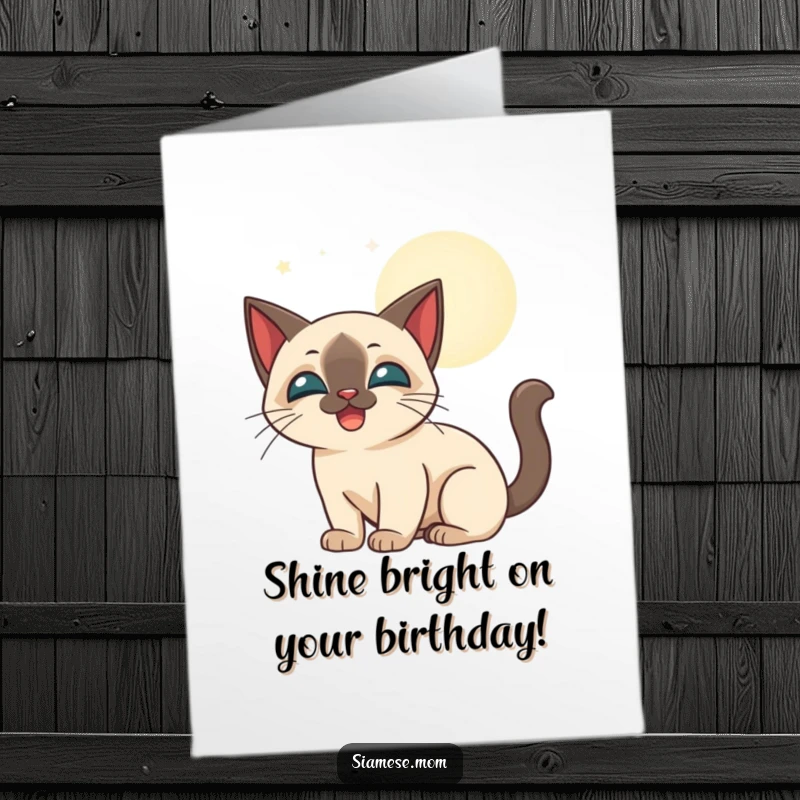 Funny Free Printable Birthday Card: a stylized, happy Siamese cat playfully bats at shimmering moonbeams under the night sky.