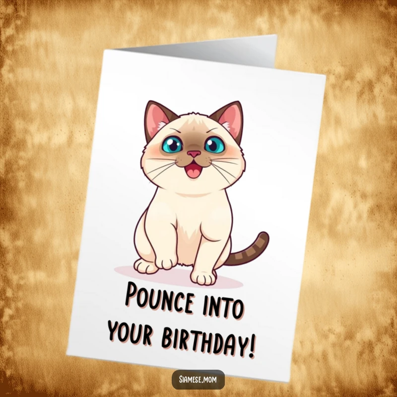Funny Free Printable Birthday Card: Playful Kawaii Siamese cat in a mid-air pounce, ready to surprise for a birthday, downloadable.
