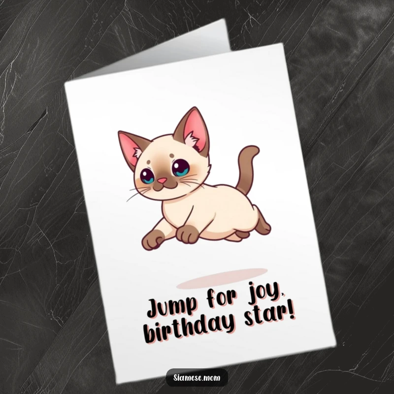 Funny Free Printable Birthday Card: Agile Kawaii Siamese Cat leaping gracefully with legs tucked in mid-air.