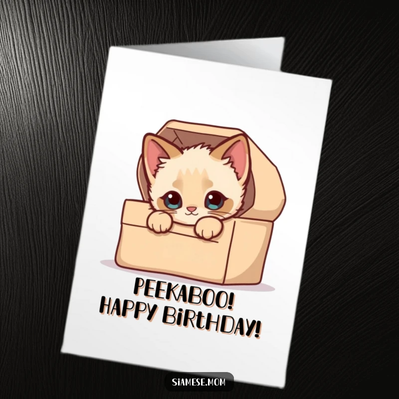 Funny Free Printable Birthday Card: Kawaii Siamese kitten peeking out of a cozy, decorated box.