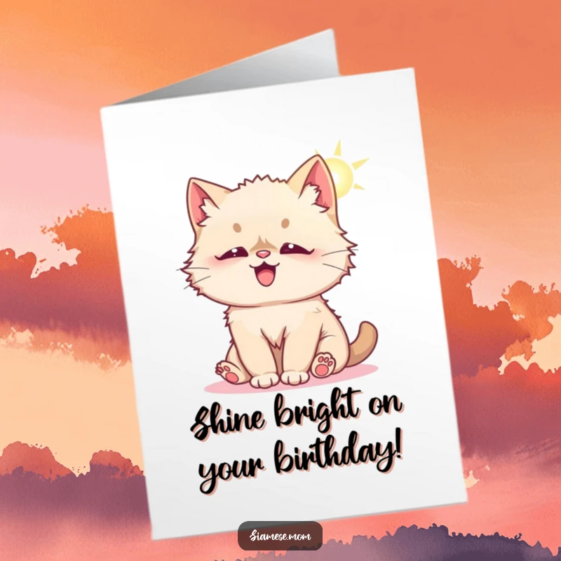 Funny Free Printable Birthday Card: A fluffy Kawaii Siamese cat bats playfully at a bright sunbeam, embodying pure delight.