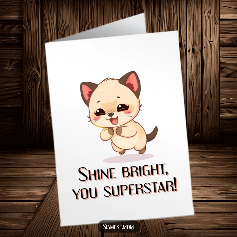 Free Printable Congratulations card with a giggling Siamese cub playfully chasing a shimmering light beam, celebrating success.