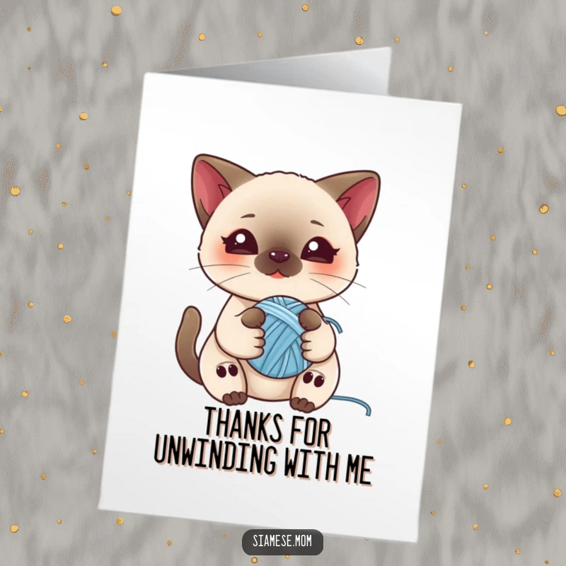 Sweet free printable thank you card with a kawaii Siamese cat holding a small ball of yarn, looking utterly adorable and grateful.