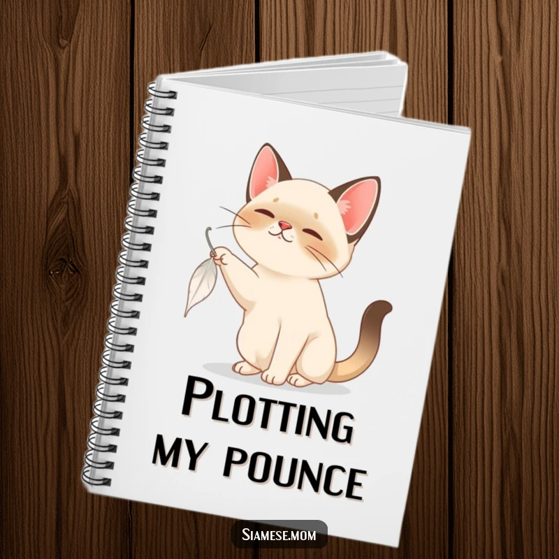 Funny Siamese Cat Notebook: A focused Siamese cat bats at a falling feather, perfect for jotting down playful ideas and notes.