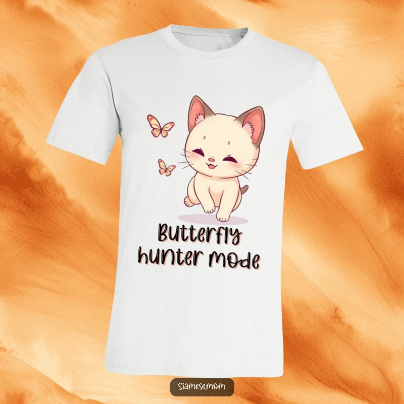 Funny Siamese Cat Butterfly T-Shirt: A dynamic cat in mid-chase, eyes fixed on a fluttering, sparkling butterfly.