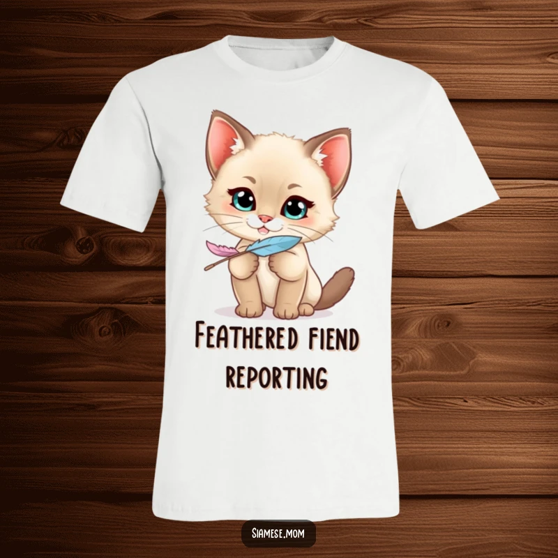 Funny Siamese Kitten T-Shirt featuring a kawaii cat with a mischievous grin holding a feather, radiating playful energy.