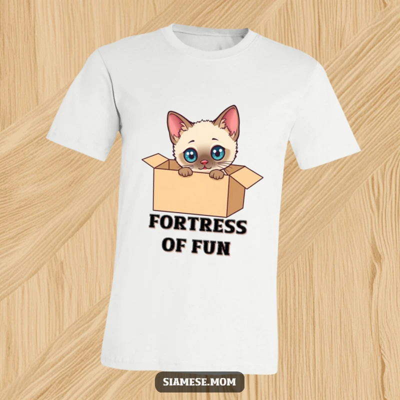Funny Siamese Cat T-Shirt: Adorable kawaii cat with huge eyes, joyfully discovering the wonders inside a cardboard box, a comical scene.