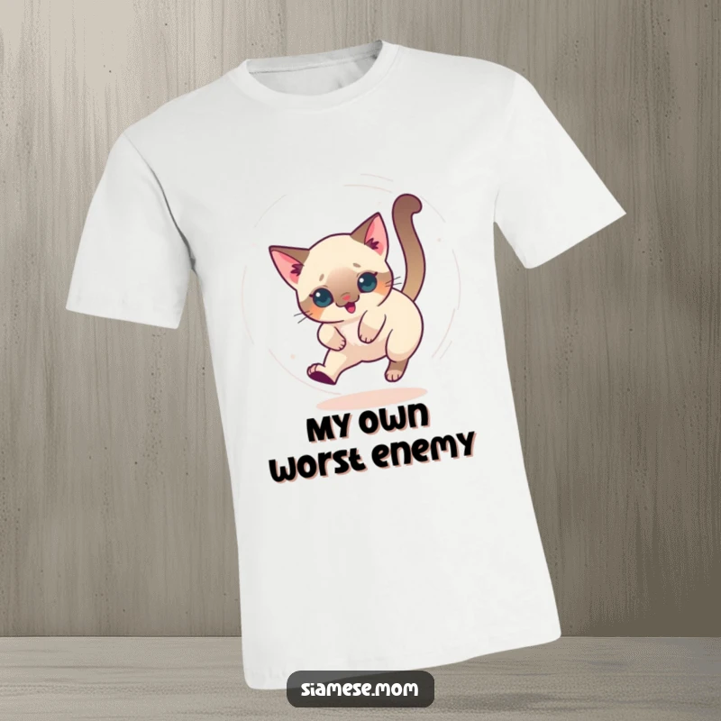 Funny T-shirt featuring a kawaii Siamese cat chasing its tail in a dizzying circle, full of playful motion.