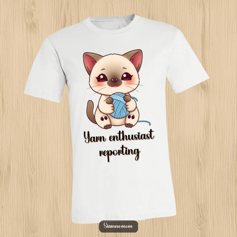 Funny t-shirt featuring a kawaii Siamese cat playing with a ball of yarn, ideal for cat enthusiasts who love cute designs.