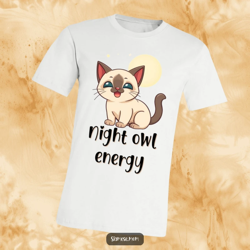 Funny stylized Siamese cat happily batting at glowing moonbeams, printed on a soft t-shirt.