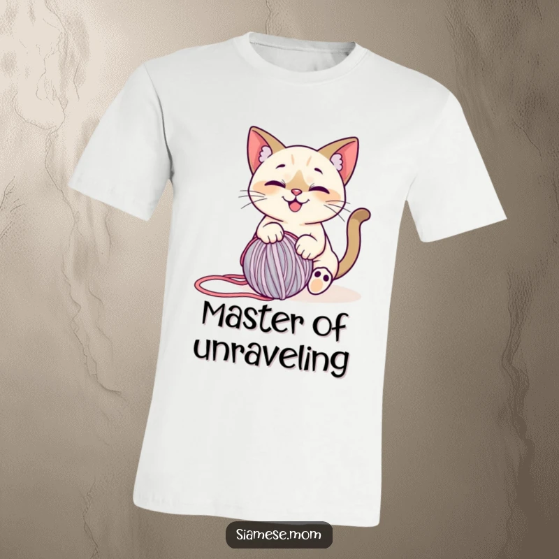 Funny Siamese Cat T-Shirt: A stylized, smiling cat happily playing with a rolling ball of yarn, exuding pure enjoyment.