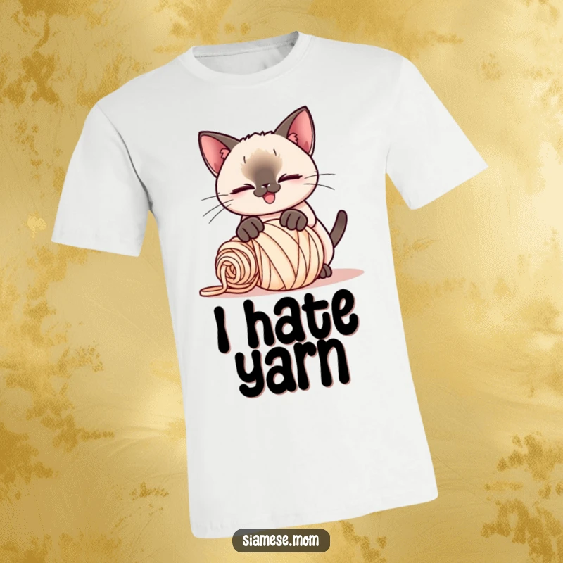 Funny Kawaii Siamese cat t-shirt, playful smirk, pouncing on a rolled-up ball of yarn, a humorous depiction of cat antics.