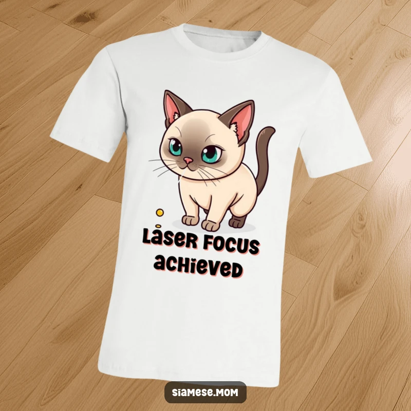 Funny t-shirt graphic of a kawaii Siamese cat intensely focused on a laser dot, embodying playful hunting instincts.