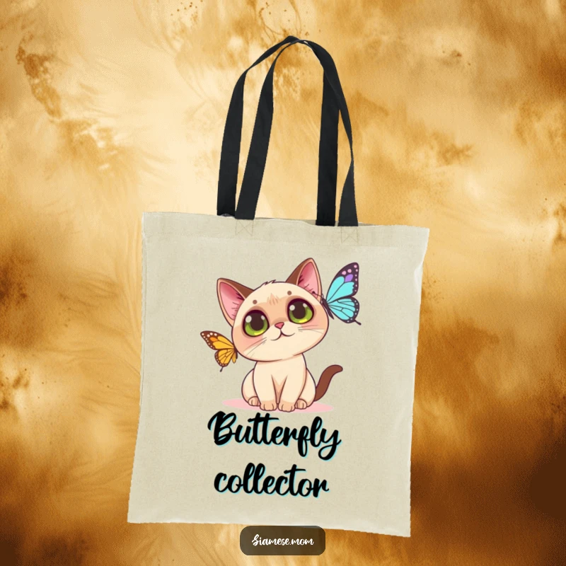 Funny Kawaii Siamese cat tote bag illustration of a wide-eyed cat about to catch a butterfly, perfect for shoppers.