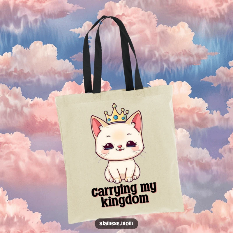 Funny tote bag design of a kawaii Siamese cat wearing a tiny crown, looking quite pleased and regal.