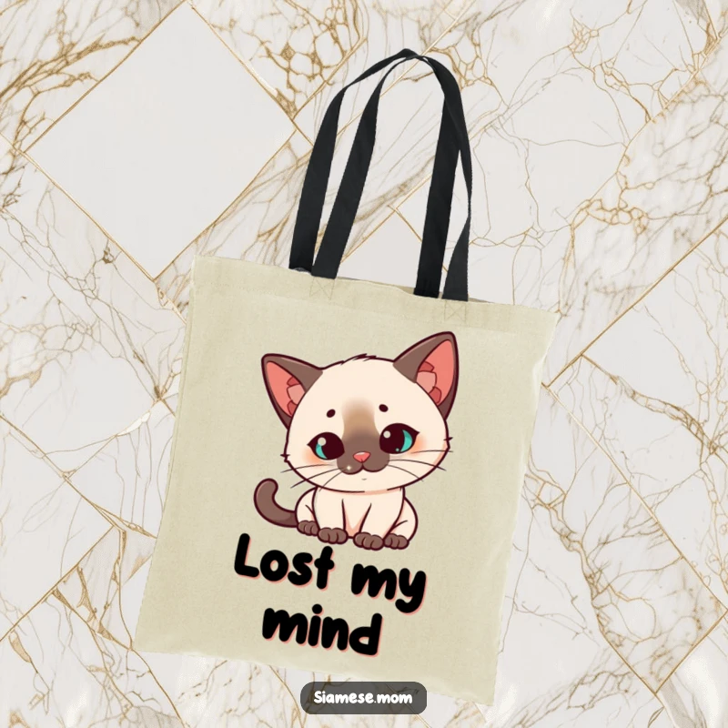 Funny Kawaii Siamese cat tote bag, quizzical head tilt, intensely watching a red laser dot, a stylish and humorous accessory.